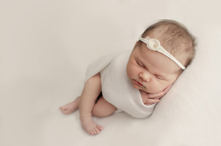 newborn in white cloth on white background Clients' Kind words & Reviews