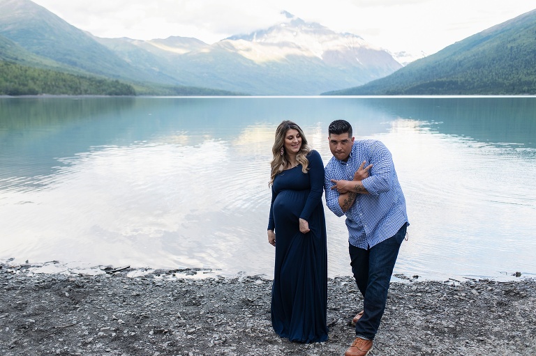 husband goofs off during Eklutna Lake Maternity Portraits