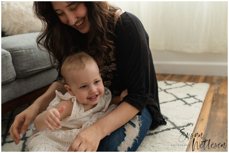 Mom and Baby girl laugh and play during Motherhood session